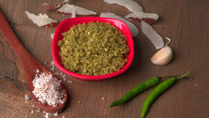 Coconut chutney in a bowl with raw coconut and green chilli ,Served with dosa, idli, vada
