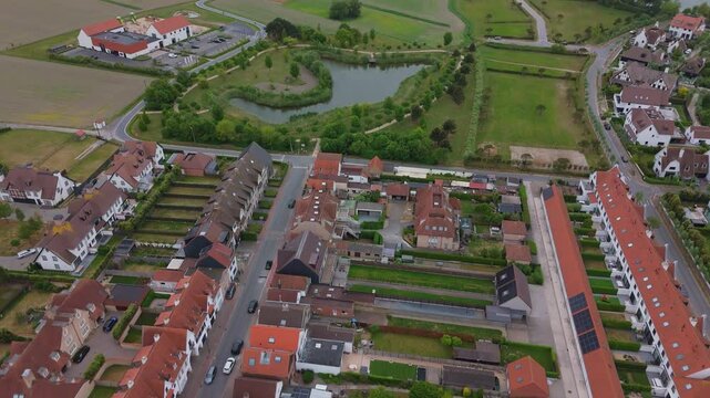 Top-Down Drone View of Residential Homes and Small Lake | FlyLens 4K