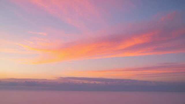 Majestic twilight. Evening sunset sky showcasing vibrant sunlight. Pastel shades. Abstract natural background. Atmospheric clouds captured with a long exposure.