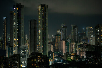 Cinematic view of Mumbai city at night. Mumbai's iconic financial district with this stunning cityscape view. Shot of Mumbai Skyline, high-rise buildings at South Mumbai, Maharashtra India.