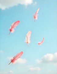 Several soft pink feathers drift slowly through the air, gently descending against the characteristic pale blue sky filled with soft, scattered clouds. 