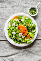 A light appetizer or an elegant side dish. Salad prepared with a mix of different varieties of leaves, enriched with orange slices, walnuts and pieces of cheese, feta, with a delicate flavor.