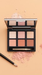 Cosmetic palette with soft shades on peach background for beauty and makeup