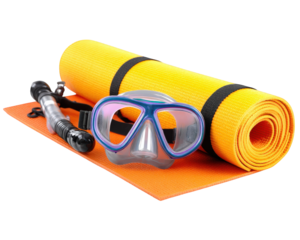Snorkeling gear including mask and snorkel, alongside vibrant beach mat, creates inviting scene for aquatic adventures. Perfect for beach lovers and water enthusiasts