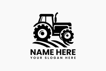 Simple black and white silhouette of a vintage tractor with large wheels on a clean white background. Agriculture concept