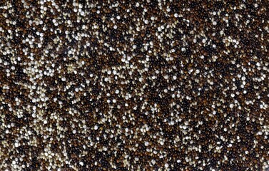 Close-Up of Tricolor Quinoa Grains in a Textured Pattern