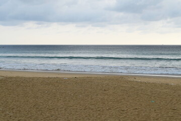 Karon beach in the evening, Phuket, Thailand. Cloudy weather.