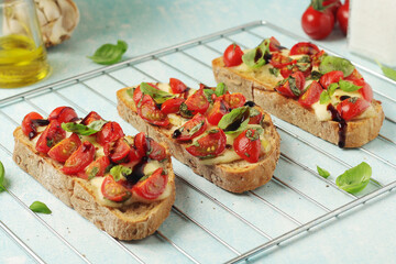 Freshly made bruschetta sandwiches - traditional dish of Italian cuisine	