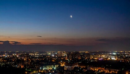 Night Cityscape Under Crescent Moon: A Serene Twilight Panorama