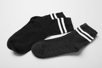 Pairs of socks on light background, closeup
