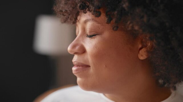 Portrait of middle-aged african american woman smiling happily, closeup view. Overweight pregnant lady enjoying calmness and solitude, diversity of people, african ethnicity, happy female person