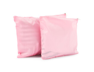 Pink packing bags isolated on white. Storage organizer