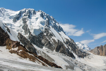 Tian Shan mountains glacier and snow summits on a sunny day with blue sky. Kyrgyzstan mountains on...