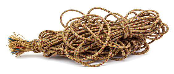 Naklejka premium A tightly wound bundle of braided rope with colorful speckles on a clean white background.
