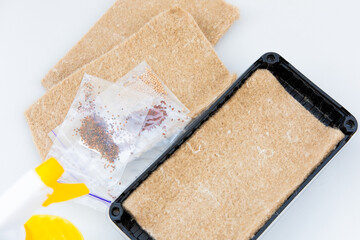 Seeds and growing medium prepared for home gardening in a compact space