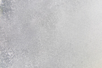 Textured surface of frost covering an outdoor landscape during winter