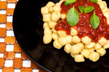 Gnocchi di patata, italian potato noodle with tomato sauce and basil