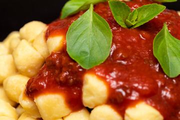 Gnocchi di patata, italian potato noodle with tomato sauce and basil