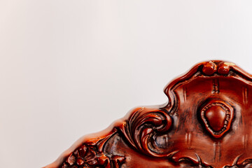Beautifully crafted vintage wooden chair detail showcasing intricate carvings