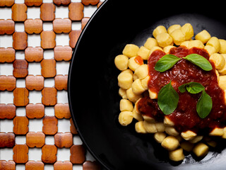 Gnocchi di patata, italian potato noodle with tomato sauce and basil