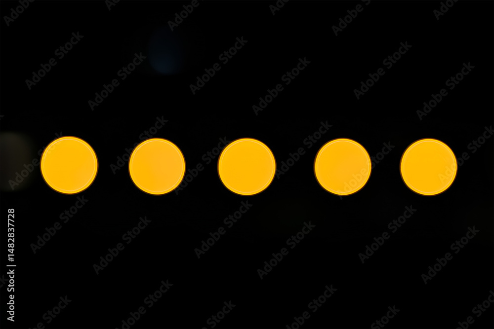 Poster a row of five evenly spaced vibrant yellow bokeh circles contrasted against a deep black background 