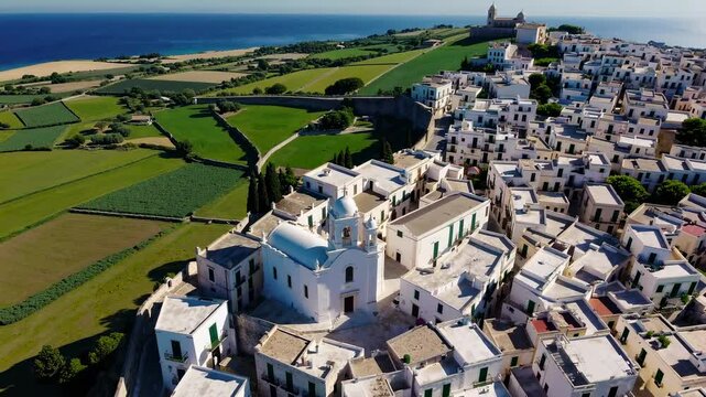 The white town of Ostuni's skyline and church are located in Brindisi, Apulia, Italy