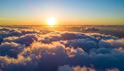 Sun goes into the clouds. Epic sunset in the sky, aerial shot. Flying above the cloud 