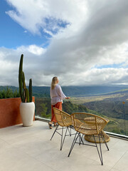 Beautiful woman relaxing on the terrace of a cafe