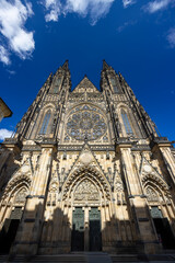 Fototapeta premium St. Vitus Cathedral rising majestically against a blue sky in Prague