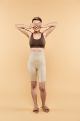 Embracing confidence and joy, a young woman celebrates body positivity in a vibrant setting