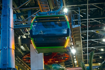 the cabin leaves the cable car parking lot, climbing up the cables. The technical elements are...