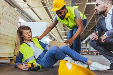 Construction Worker Providing Aid After Workplace Injury at an Industrial Setting