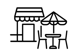 Outdoor cafe with seating and parasol in a lively urban setting during a sunny afternoon