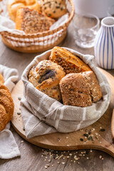 Assortment of bread, rolls and bakery products with salt, butter and seeds