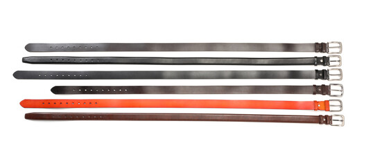Different leather belts isolated on white, top view