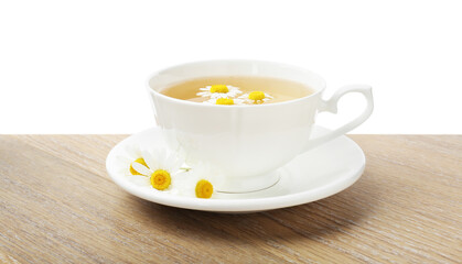 Delicious chamomile tea in cup and fresh flowers on wooden table against white background