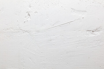 A white wall with a white paint splatter on it