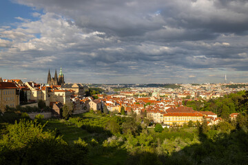 Prague Castle dominating the cityscape under dramatic cloudy sky in Czechia