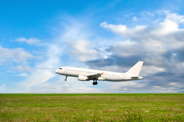 Airplane flying in the sky after taking off the runway, white airplane at the airfield, preparing for taking off