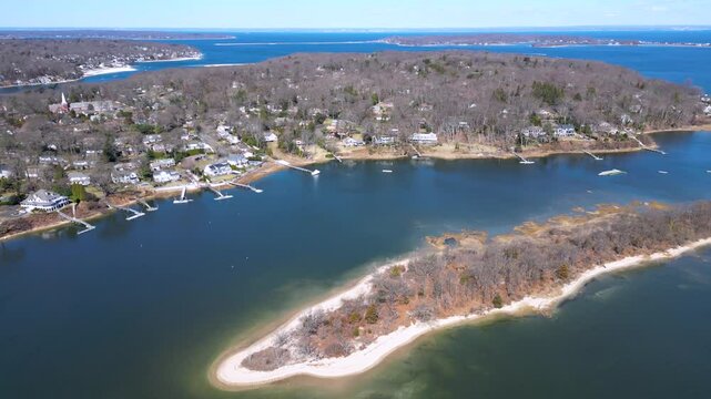 Drone footage of Bird Island between Northport Bay and Centerport Harbor, showing coastal homes, marinas, and the shoreline of Long Island&rsquo;s North Shore on a peaceful sunny day.