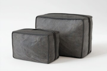 Two dark gray mesh storage cubes sit side by side, offering a stylish and practical solution for organizing belongings.