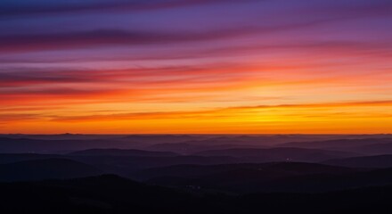 Obraz premium Colorful sunset over mountain ranges