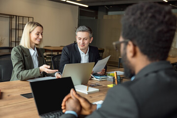 Lawyers working together on the project and looking interested and involved