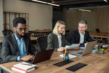 Lawyers working together on the project and looking interested and involved