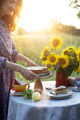 girl serving tea table in the garden