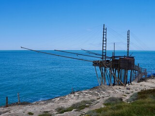 Panoramic view of Trabucco San Lorenzo, traditional wooden structure used for fishing in Southern Italy. Vieste, Puglia, Italy.