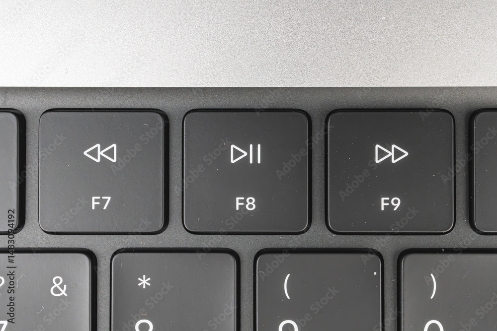Fototapete close-up shot of numeric keypad on a computer keyboard, with keys labeled from 7 to 9, arrow keys fo