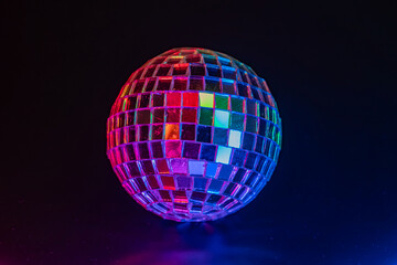 A shimmering disco ball reflecting colorful lights, evoking a lively dance party ambiance