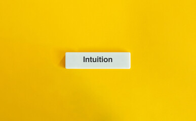 Intuition Word on Letter Tile against Yellow Background.