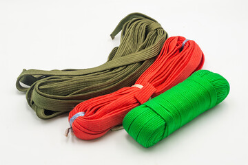 Colored ropes in vibrant shades of green, red, and olive isolated on white background